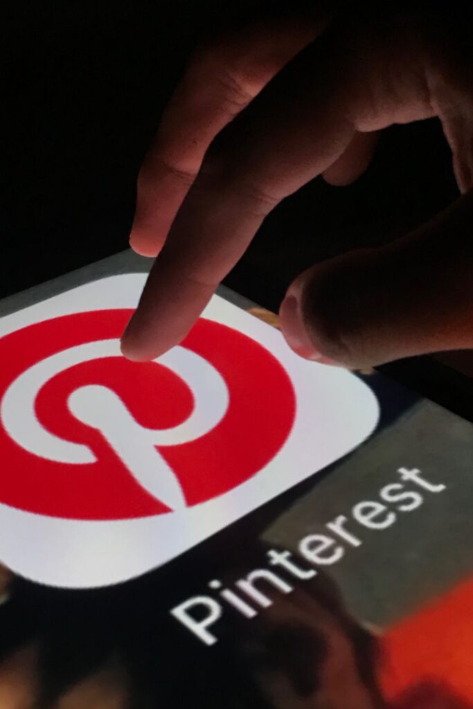 My hand touching giant pinterest icon