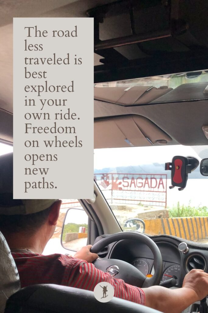 First-Time in Sagada? My 10 Practical Tips Before Visiting 5 The Perks of Using a Private Vehicle, quote, signage of Sagada seen from the shuttle windshield