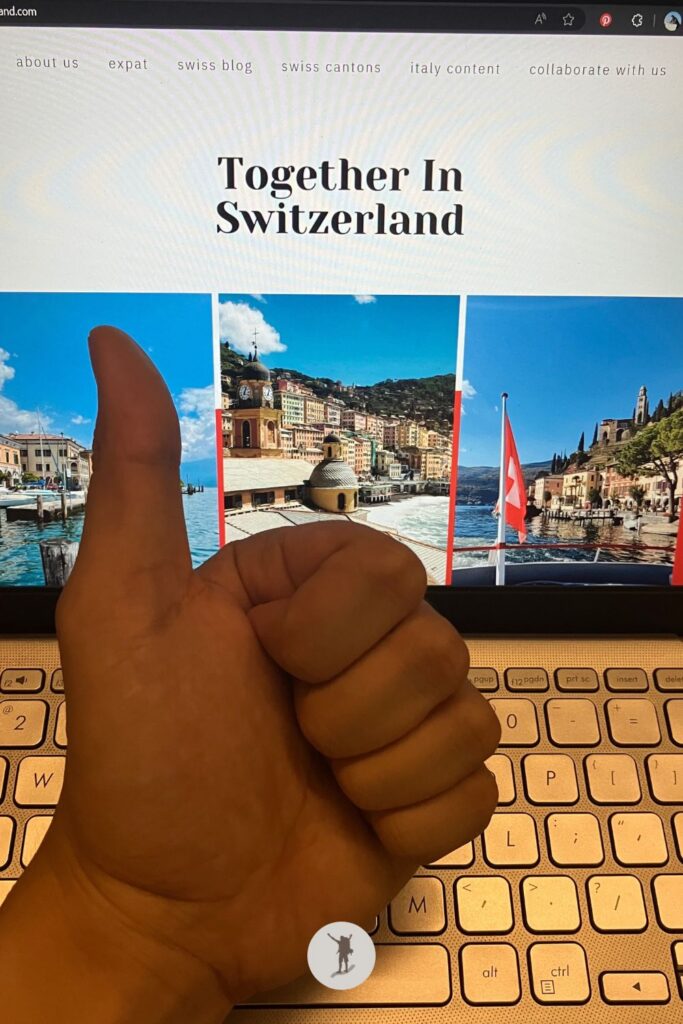 My laptop screen is displaying the homepage of Together In Switzerland