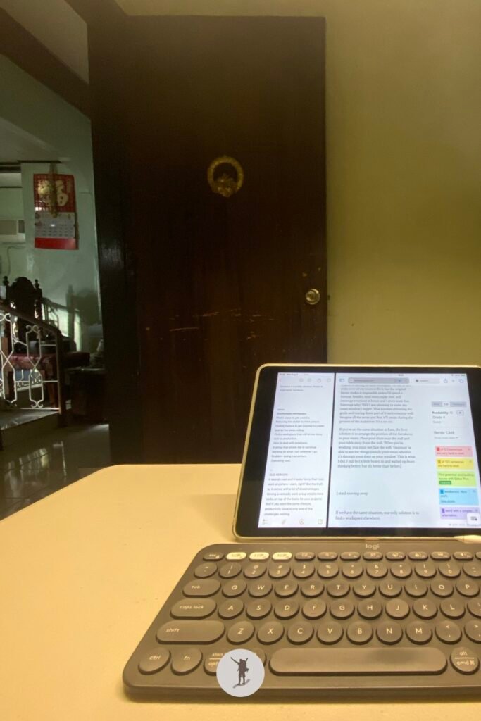 The Challenges of Building a Creator Business Without an Ideal Workspace (and My Solutions) 5 The view of my laptop and our living room from my latest workspace below my loft bed