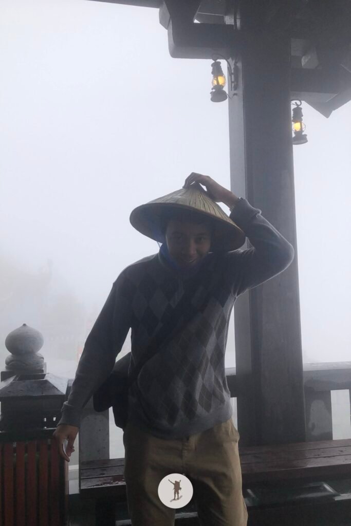 Reality vs Expectation of Visiting Fansipan from Sa Pa: How You Can Avoid Disappointments 16 Eljon removing his hat before boarding the funicular in Fansipan, Sa Pa, Vietnam
