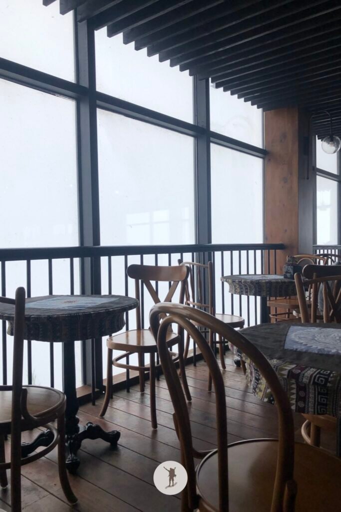 Reality vs Expectation of Visiting Fansipan from Sa Pa: How You Can Avoid Disappointments 23 The view from Du Soleil Cafe when it rains in Fansipan, Sa Pa, Vietnam