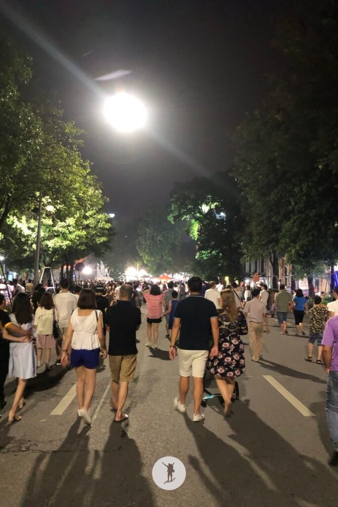 Big crowd walking to the heart of the city to enjoy Hanoi Walking Street, Hanoi, Vietnam