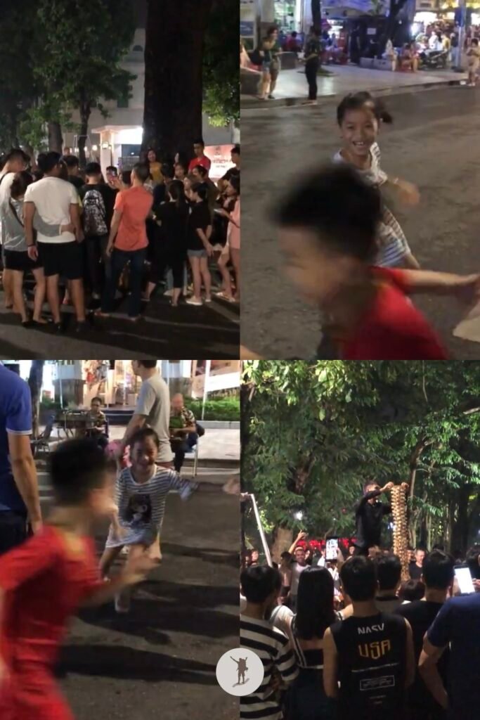 Kids and teens playing, singing, and doing games during Hanoi Walking Street, Hanoi, Vietnam