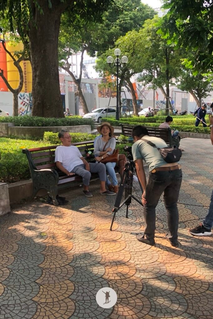 Locals getting interviewed my media in Hoan Kiem Lake in Hanoi, Vietnam