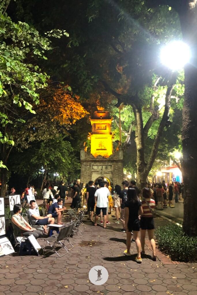 One of the gates of Hanoi surrounded by tourists and locals during Hanoi Walking Street, Hanoi, Vietnam