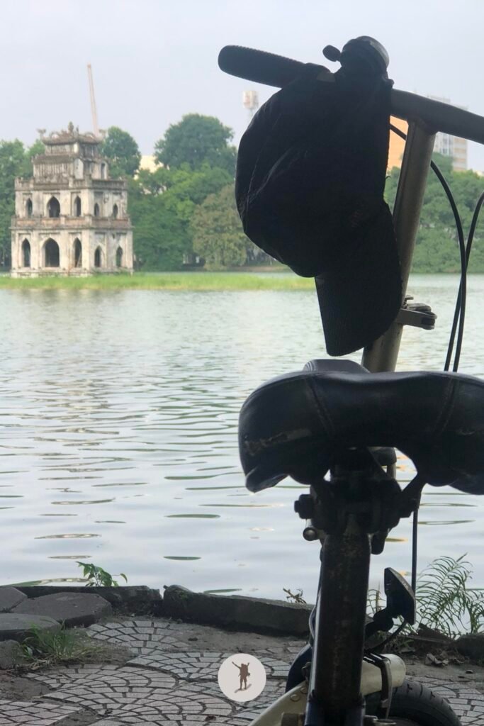 View of the Turtle Temple with a bike in front in Hanoi, Vietnam