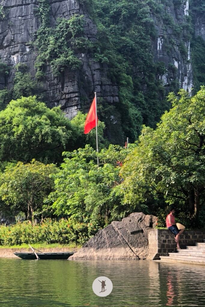 A Vietnamese flag in near a temple in Trang An, Ninh Binh, Vietnam