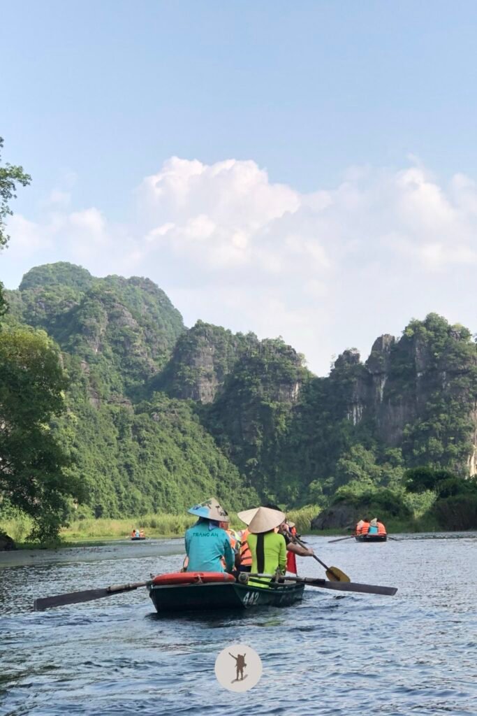 Boats and the rugged mountains of Trang An in Ninh Binh, a Day Trip from Hanoi, Vietnam