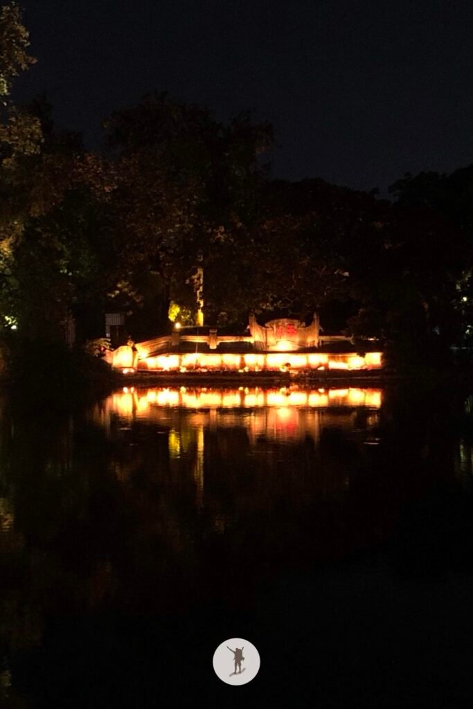 Lake with mirror reflection of the temple seen during Hanoi Walking Street, Hanoi, Vietnam