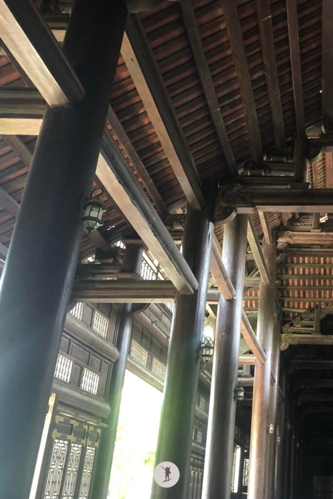 Left side — The impressive wooden architecture of the temples in Bai Dinh Pagoda, Ninh Binh, Vietnam