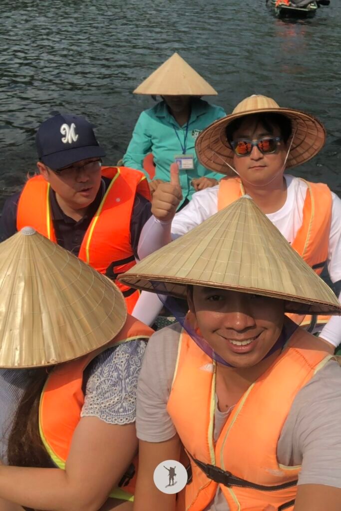 Me, my friend, and our Korean acquaintances while having a boat tour in Trang An, Ninh Binh, Vietnam
