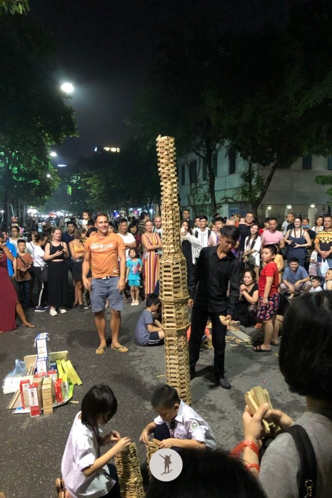 Popsicle stick tower competition during Hanoi Walking Street, Hanoi, Vietnam