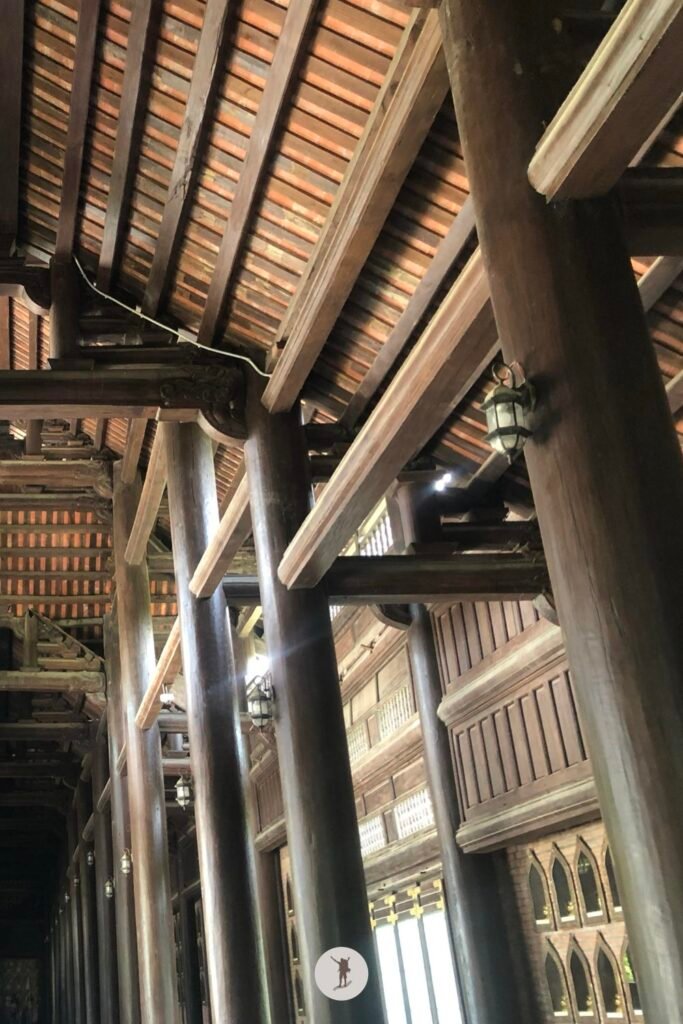 Right side — The impressive wooden architecture of the temples in Bai Dinh Pagoda, Ninh Binh, Vietnam