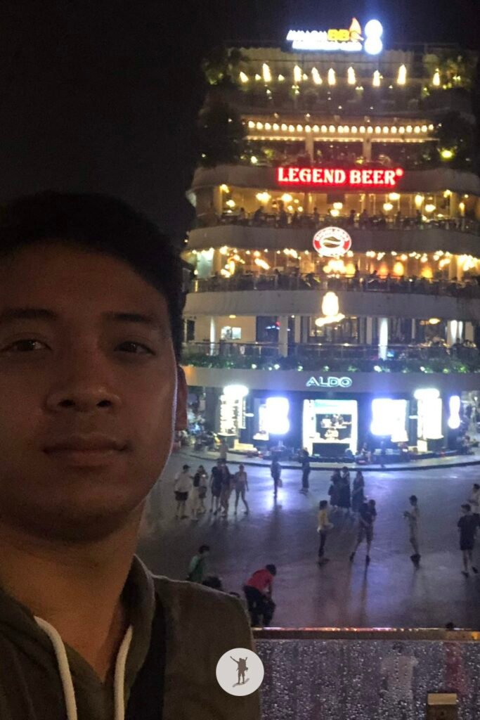 Selfie with the Shark Jaw building in Dong Kinh Nghia Thuc Square in Hanoi, Vietnam