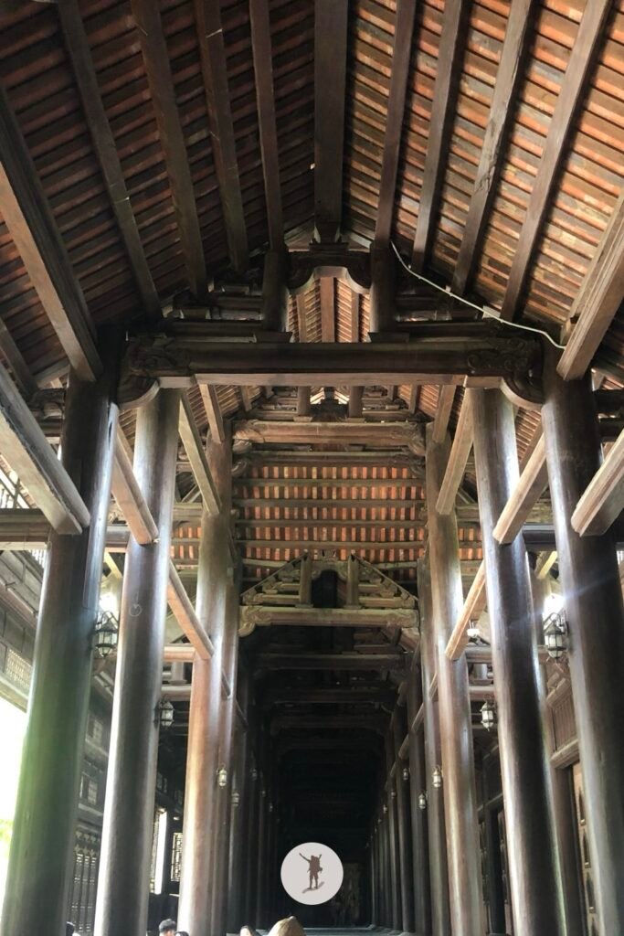 The rustic interiors of a temple in Bai Dinh Pagoda, an attraction you’ll visit on a day trip to Ninh Binh from Hanoi, Vietnam