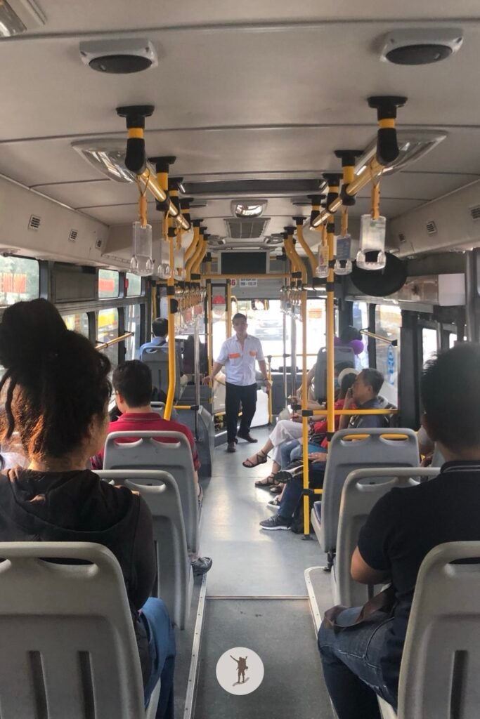 Bus 86 conductor giving funny jokes and tips about their country, Hanoi, Vietnam