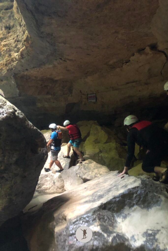 Careful walking on massive rocks while canyoneering in Kawasan Falls, Cebu, Philippines