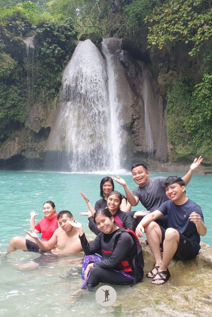 Complete group photo in front of Kawasan Falls, Cebu, Philippines