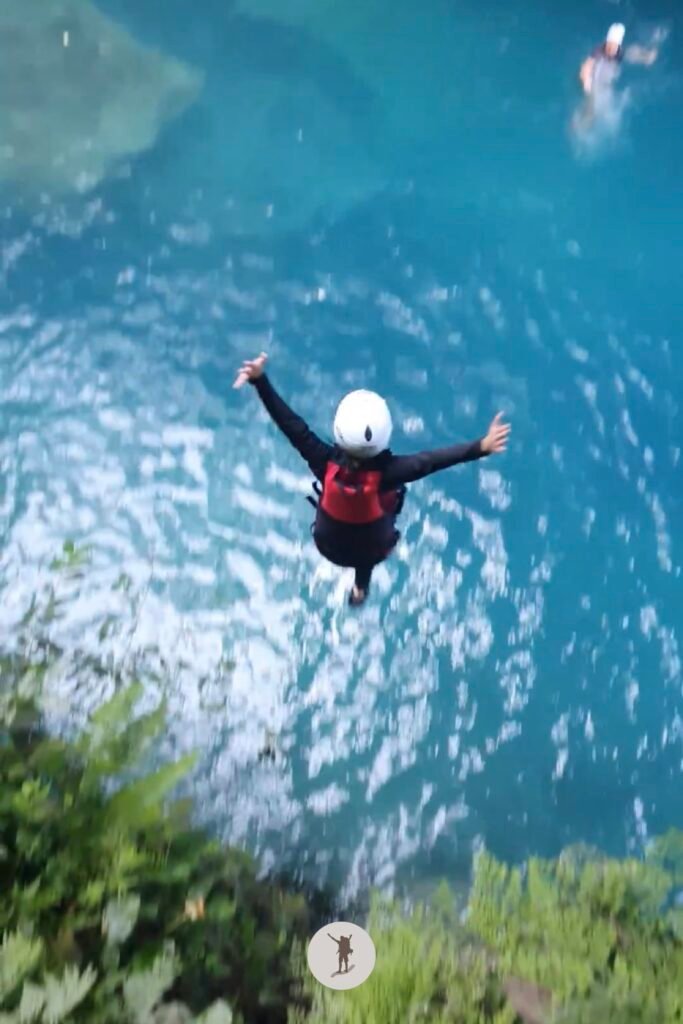Feels like flying during the 10-meter cliff jump in Kawasan Falls canyoneering, Cebu, Philippines