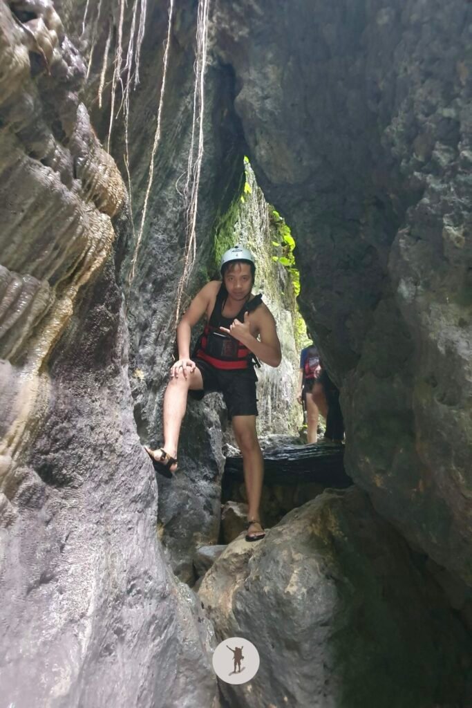 Me passing through the cave-hole features of the canyoneering trail in Kawasan Falls, Badian, Cebu, Philippines