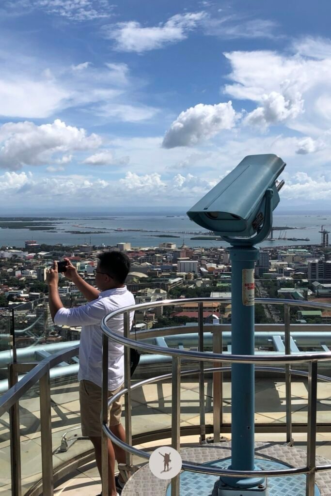 My friend taking photos at the observation deck on top of Crown Regency, Cebu City, Cebu, Philippines