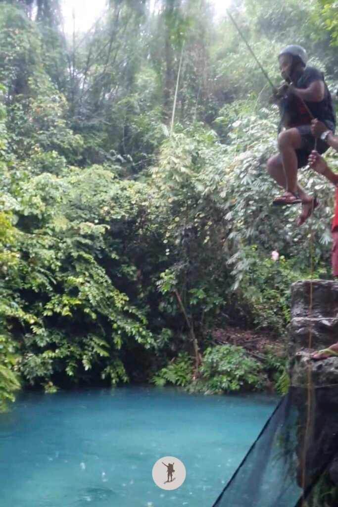 Part 1, my friend taking the rope swing near the end of Kawasan Falls Canyoneering, Cebu, Philippines