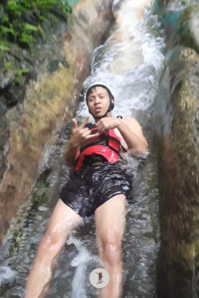 Part 2, me sliding down the last and longest slide near the end of Kawasan Falls Canyoneering, Cebu, Philippines