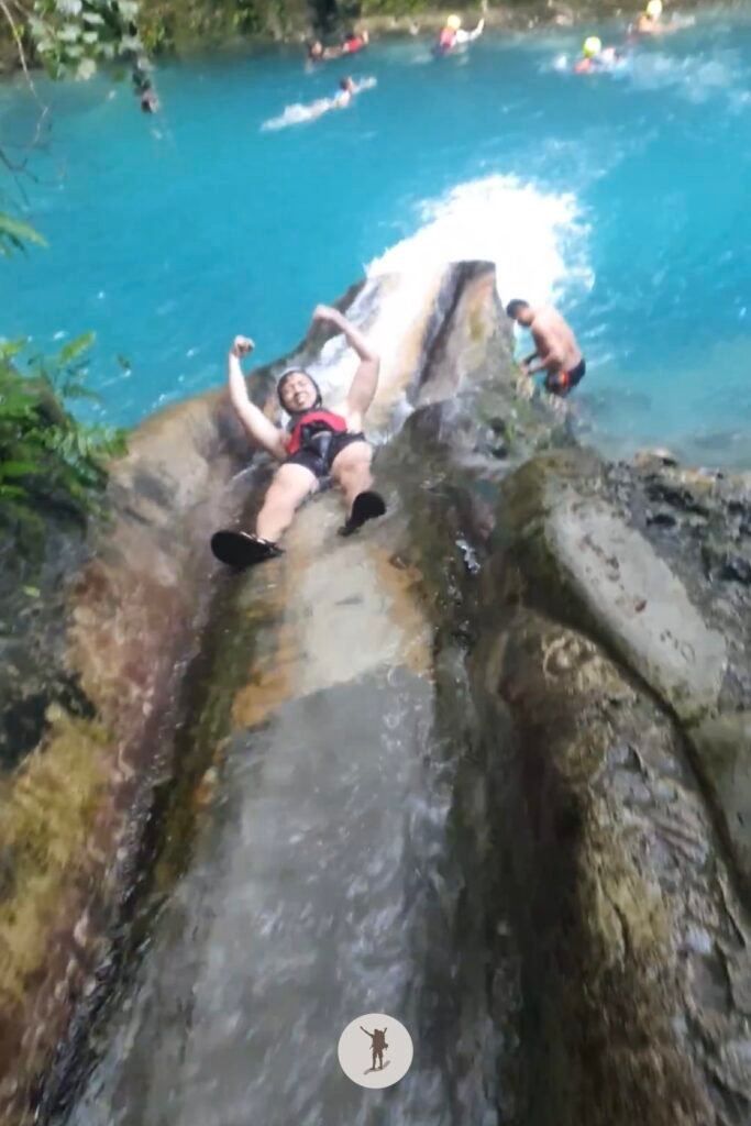 Part 3, me sliding down the last and longest slide near the end of Kawasan Falls Canyoneering, Cebu, Philippines