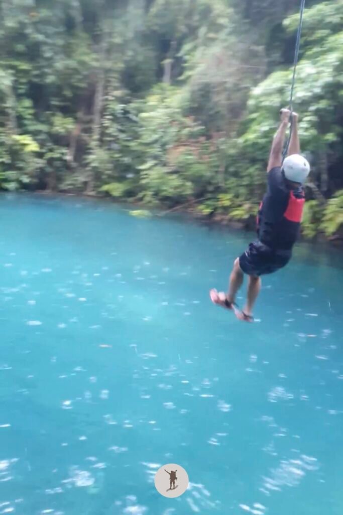 Part 3, my friend taking the rope swing near the end of Kawasan Falls Canyoneering, Cebu, Philippines