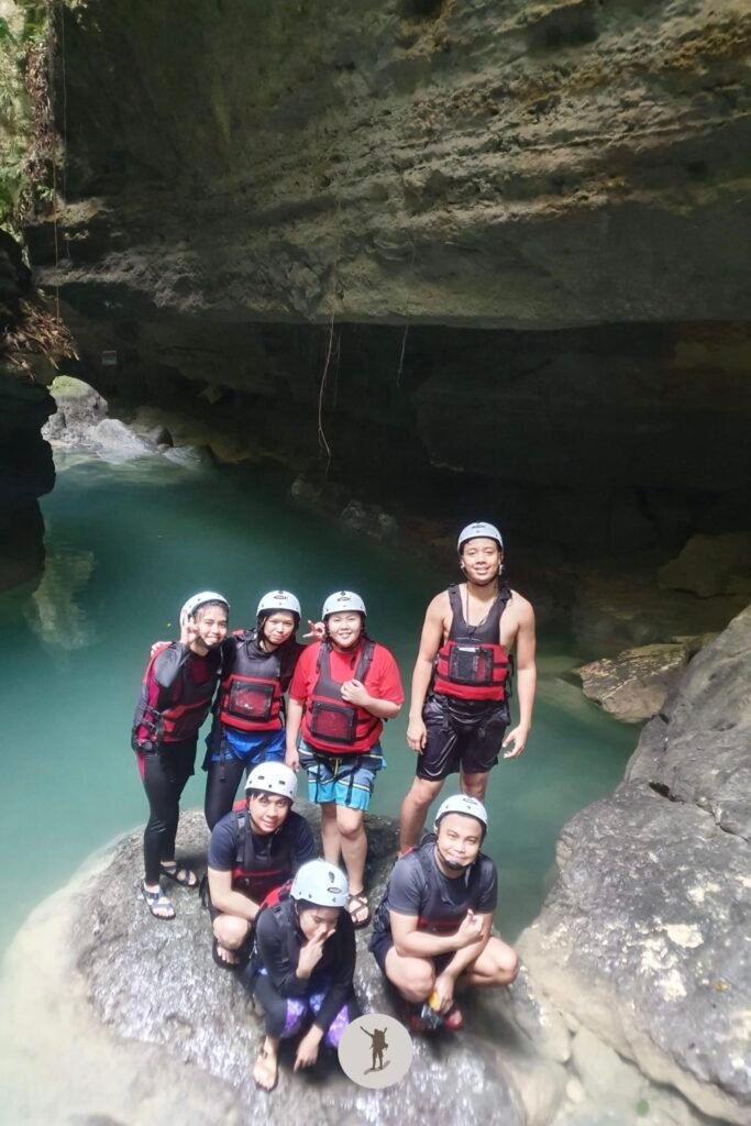The turquoise water and canyon walls that you will see when you go on canyoneering in Kawasan Falls, Cebu, Philippines