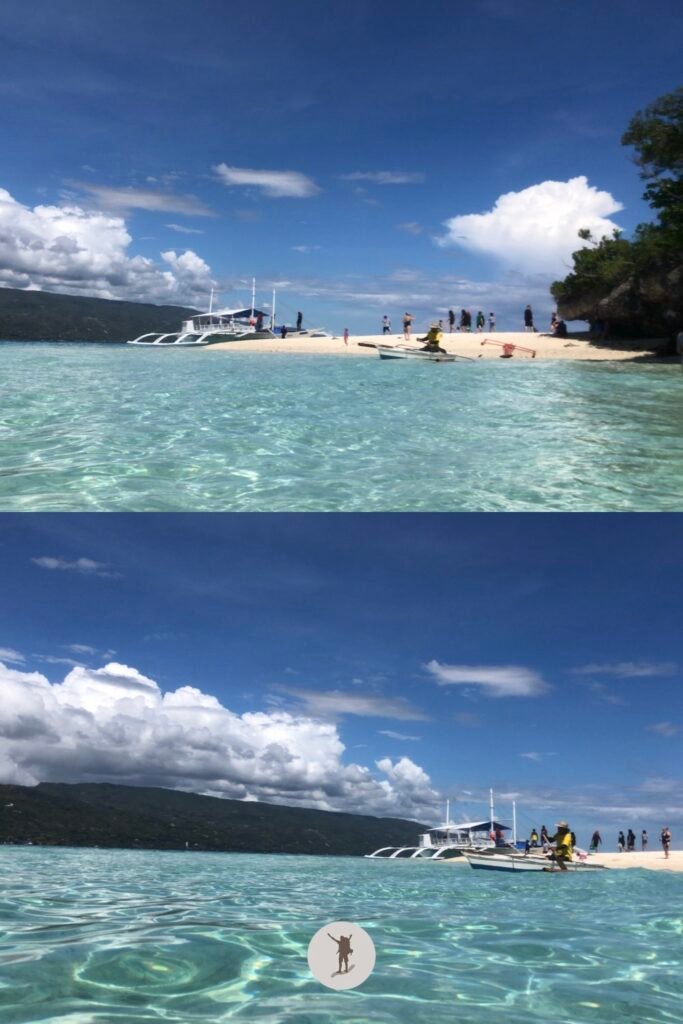 The view of our boat and the white sands of Sumilon Island, near Oslob, Cebu, Philippines