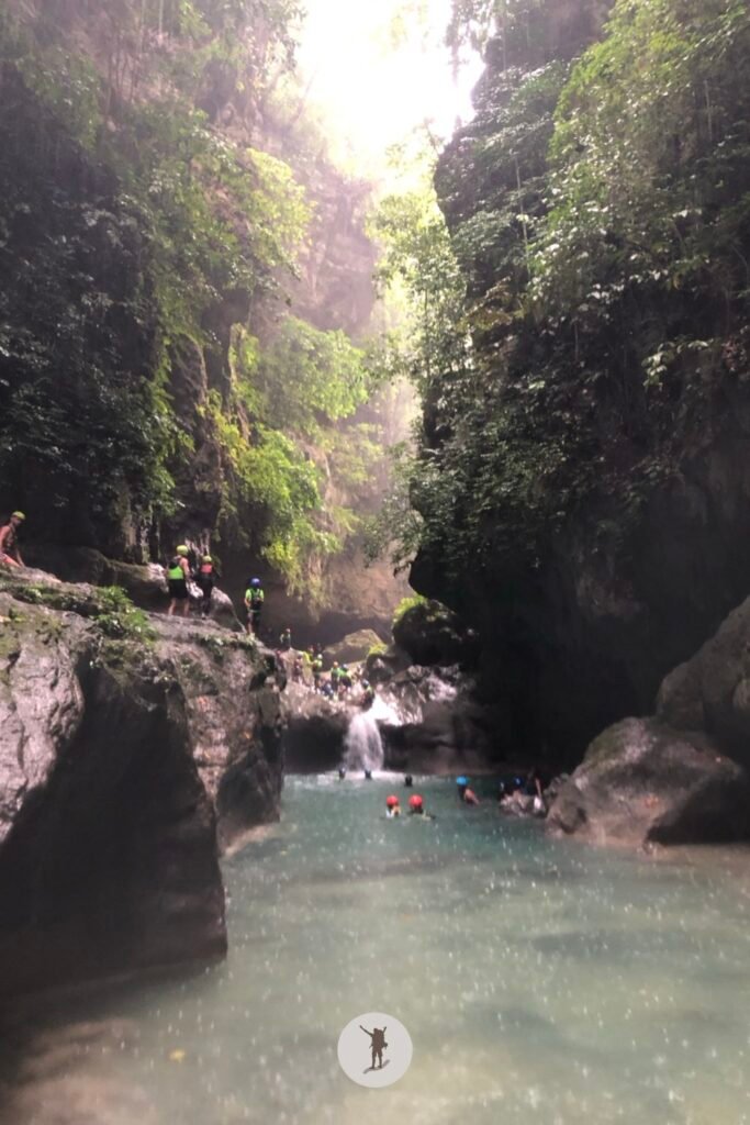 towering canyon walls you’ll see while canyoneering in Kawasan Falls, Cebu, Philippines