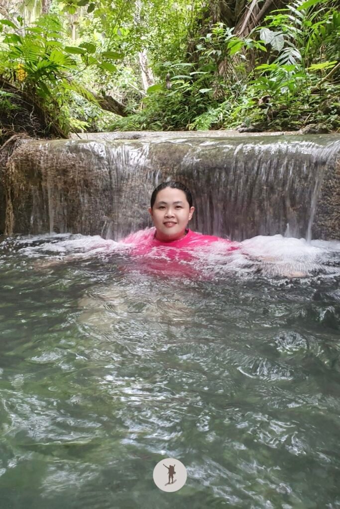 My friend enjoying the cold, clear water of Aguinid Falls, Cebu, Philippines