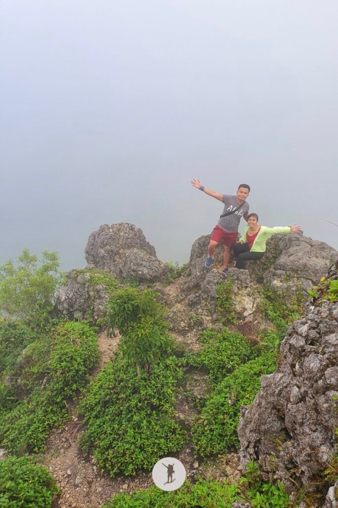 Our Expectation vs. Reality Hiking Osmeña Peak in Cebu and Tips Before You Hike 11 My friends waiting for the clouds to go away while in the summit of Osmena Peak, Cebu, Philippines