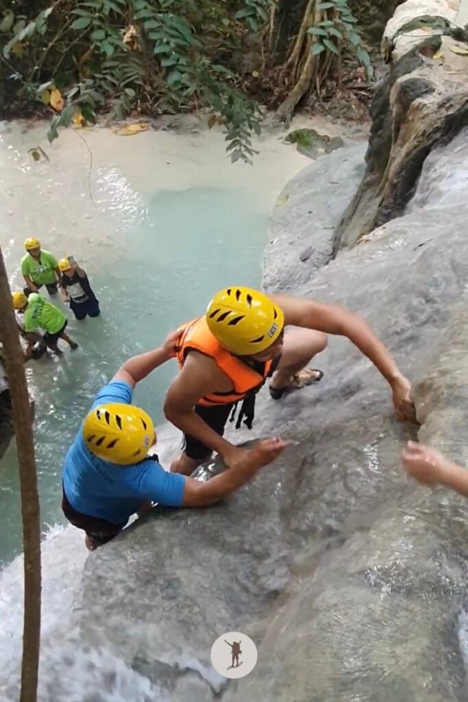 Part 3, a photo of me climbing a near-vertical rock formation at Aguinid Falls, Cebu, Philippines