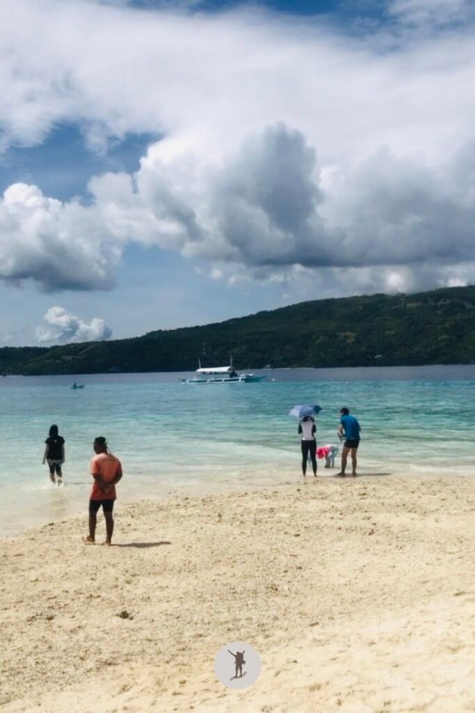 Our Beautiful Experience Visiting Sumilon Island After Whale Shark Watching in Oslob 17 Tourists exploring the sand bar of Sumilon Island during high tide, Oslob, Cebu, Philippines