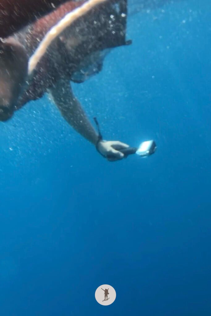 View below the surface of the water of my friend snorkeling in Moalboal, Cebu, Philippines