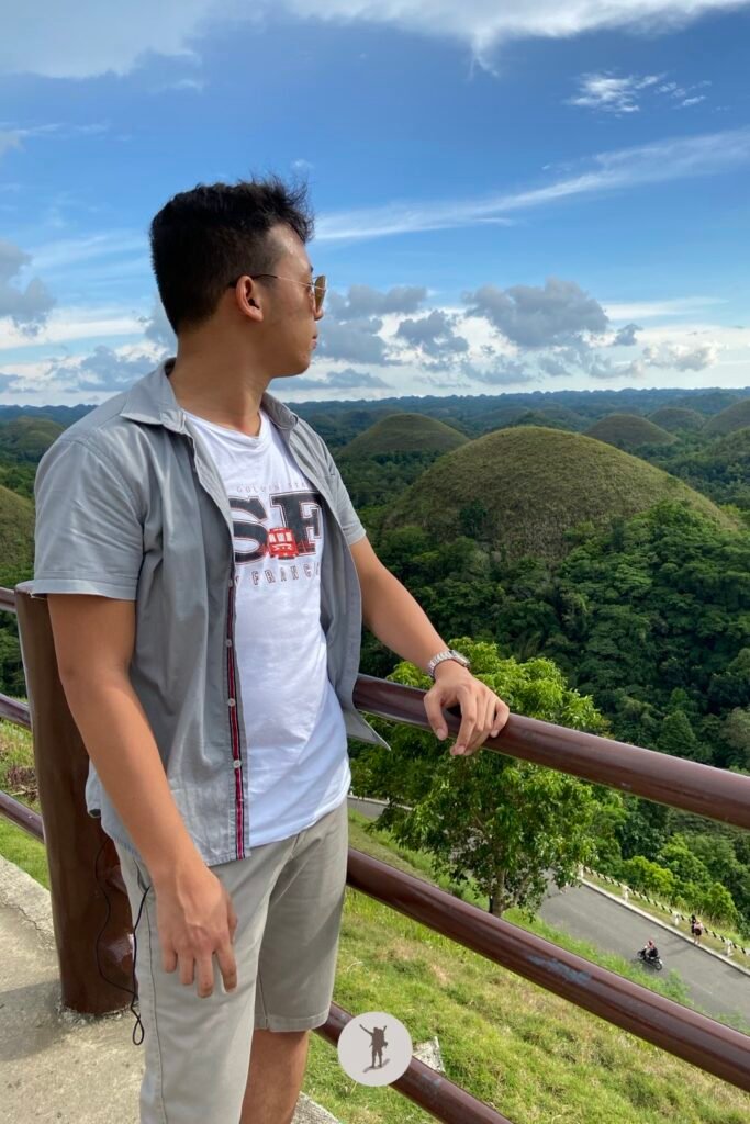 Our Unforgettable 5-Day Central Visayas Trip That You Can Easily Follow For Your Trip 3 A picture of me taking in the beautiful scenery of the Chocolate Hills, Bohol, Philippines