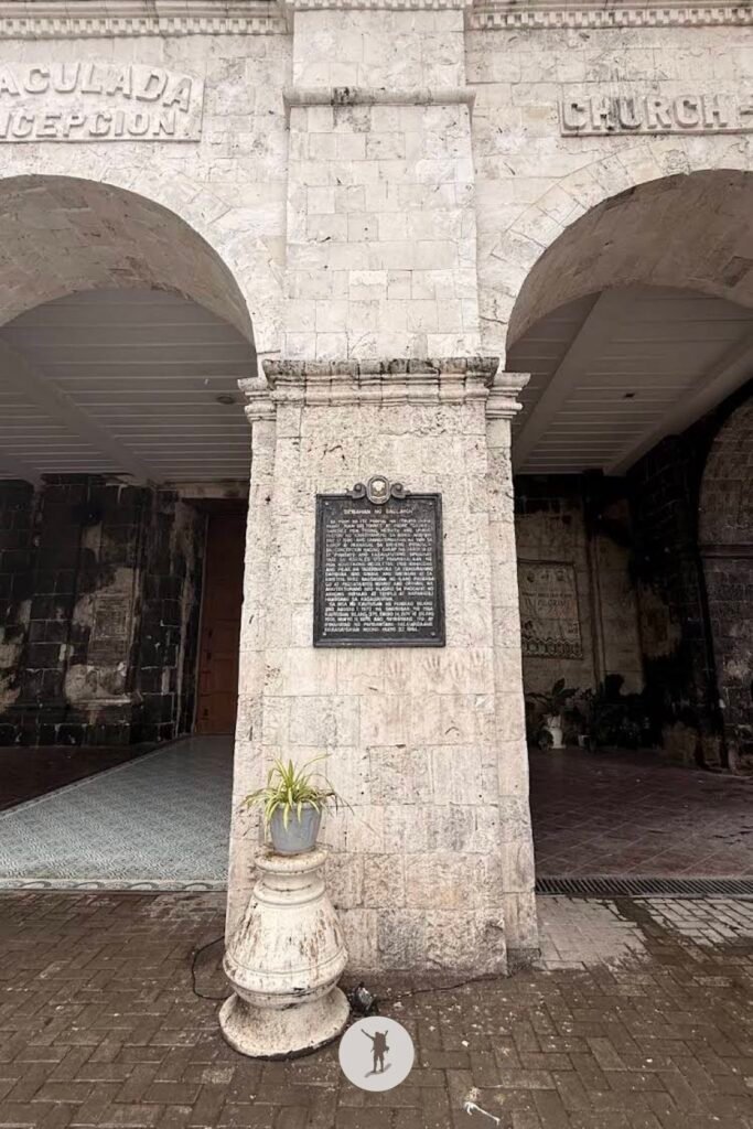 At the entrance of Baclayon Church, Bohol, Philippines