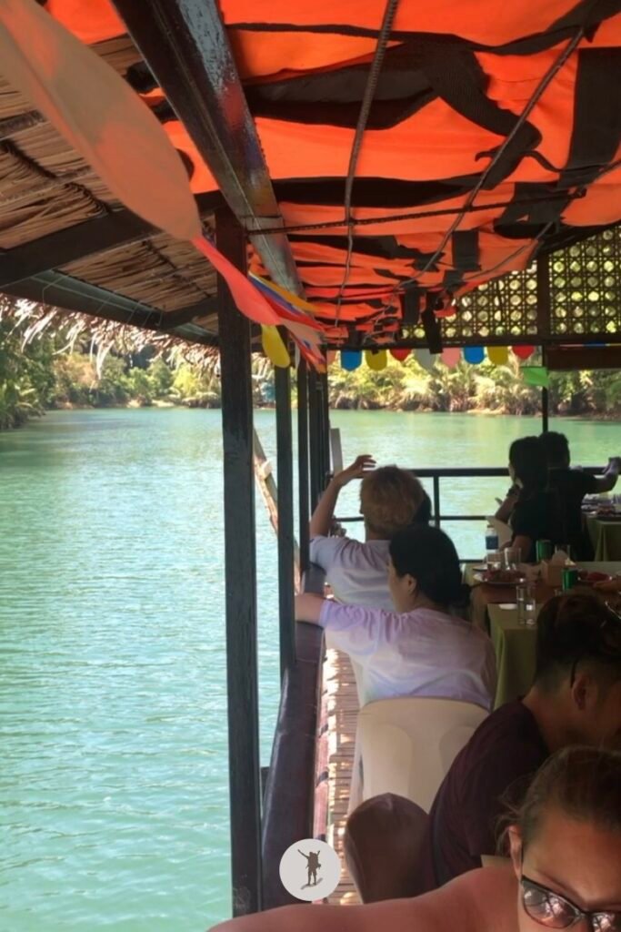 Other tourists sight seeing from our floating restaurant along river cruise, Bohol, Philippines