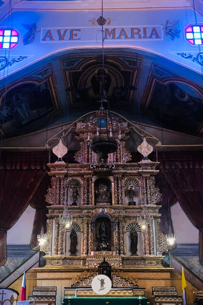 The stained glass windows of Baclayon Church above the altar, Bohol, Philippines