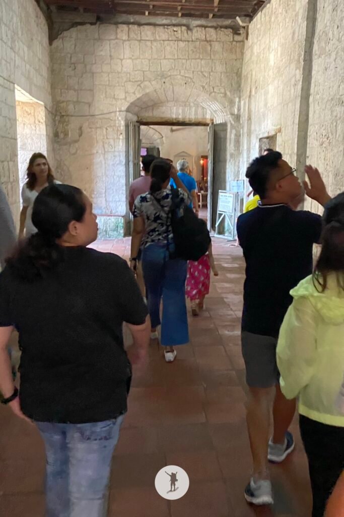 Travelers exploring Baclayon Church, Bohol, Philippines